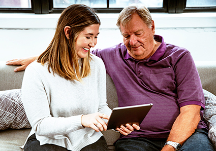 Father and daughter with tablet