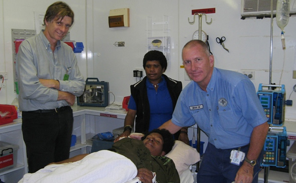 Dr-Dent-and-Michael-Conlon-assisting-at-Juni-Clinic-PNG-1999